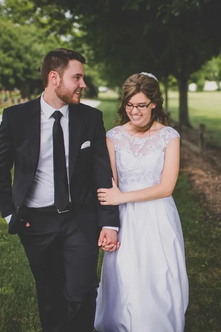 wedding photo of bride and groom walking